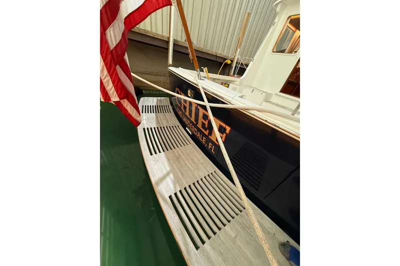 Slide: The Image of 2000 Grand Banks 43 Eastbay FB docked with American flag and Fort Lauderdale signage. - 34