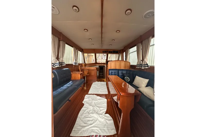 Slide: The Image of 2000 Grand Banks 43 Eastbay FB yacht docked indoors, showcasing elegant design. - 4