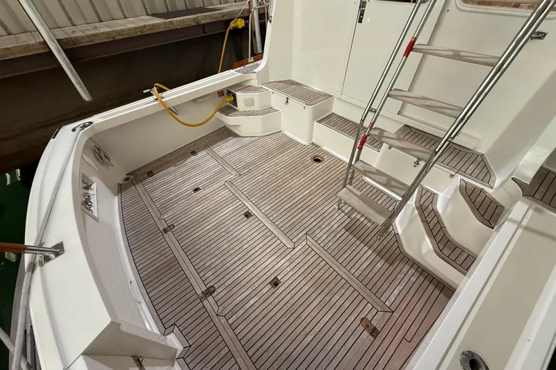 Slide: The Image of Grand Banks 43 Eastbay FB 2000, teak deck and stairs in cockpit. - 42