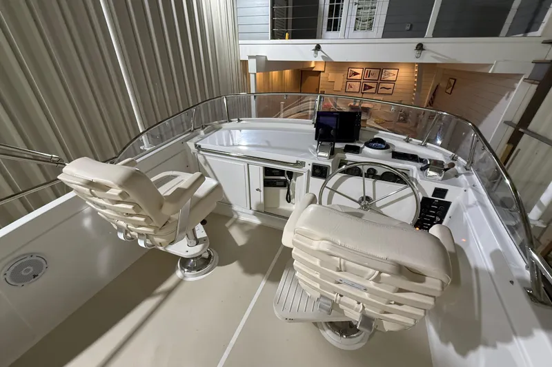 Slide: The Image of Flybridge of 2000 Grand Banks 43 Eastbay FB with dual helm seats and navigation equipment. - 46