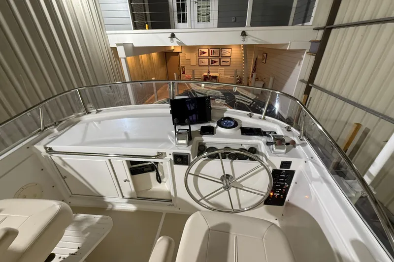 Slide: The Image of Helm of 2000 Grand Banks 43 Eastbay FB yacht with steering wheel and navigation instruments. - 48
