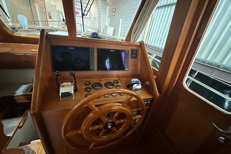 Slide: The Image of 2000 Grand Banks 43 Eastbay FB yacht docked indoors, showcasing elegant design and craftsmanship. - 5