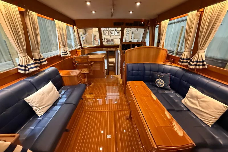 Slide: The Image of Luxurious interior of 2000 Grand Banks 43 Eastbay FB yacht with elegant wood and leather furnishings. - 54