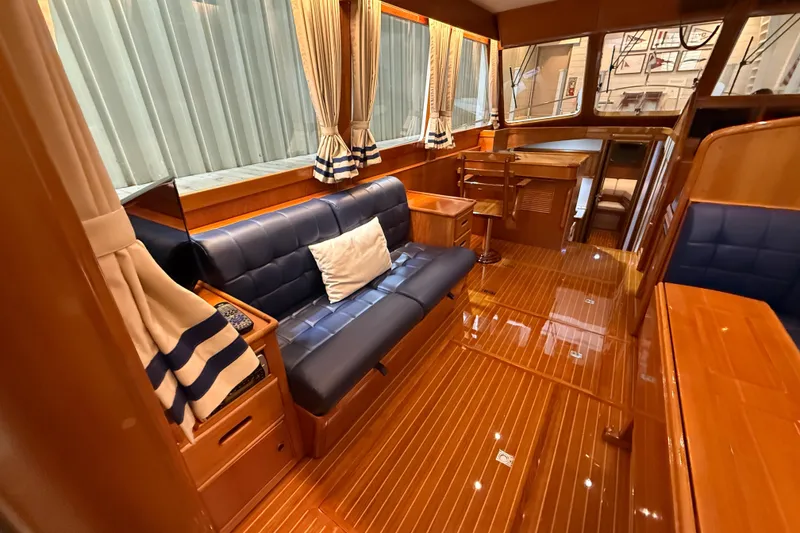 Slide: The Image of Luxurious interior of 2000 Grand Banks 43 Eastbay FB yacht with elegant wood finish. - 57