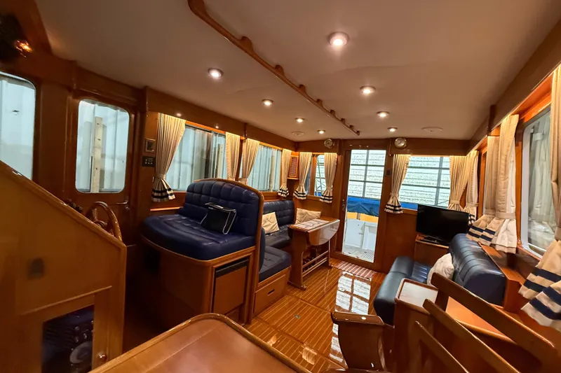 Slide: The Image of Luxurious interior of 2000 Grand Banks 43 Eastbay FB yacht with elegant wood finishes. - 67