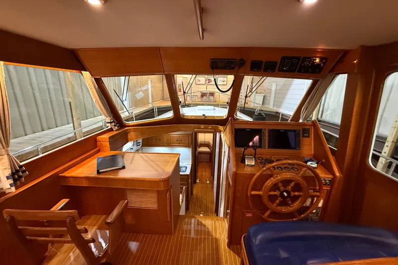 Slide: The Image of Interior of 2000 Grand Banks 43 Eastbay FB yacht with wooden helm and navigation equipment. - 68