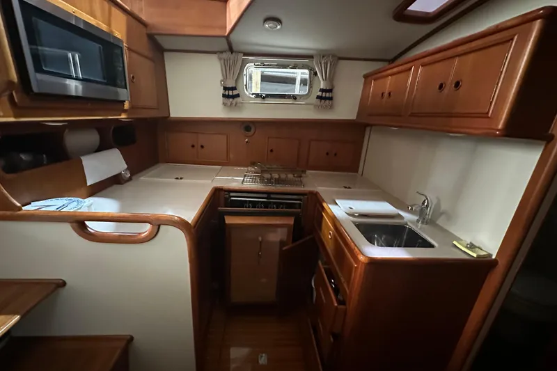 Slide: The Image of 2000 Grand Banks 43 Eastbay FB yacht docked in an indoor marina. - 7