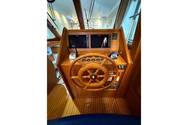 Slide: The Image of Helm of 2000 Grand Banks 43 Eastbay FB with wooden wheel and navigation screens. - 74