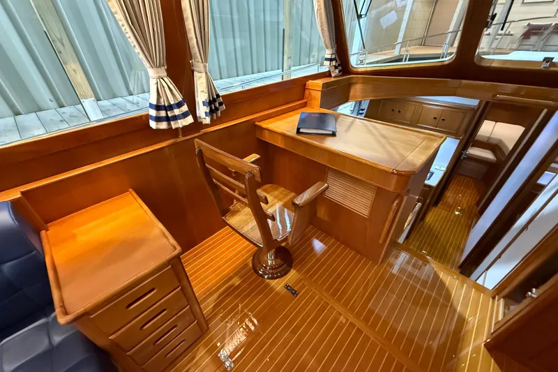 Slide: The Image of Luxurious wooden interior of 2000 Grand Banks 43 Eastbay FB yacht with elegant furnishings. - 82