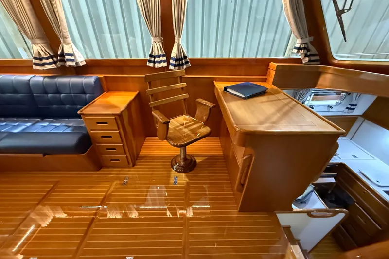 Slide: The Image of Luxurious interior of 2000 Grand Banks 43 Eastbay FB with wooden furnishings and seating. - 83