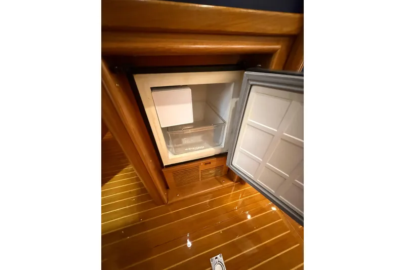 Slide: The Image of Open refrigerator on 2000 Grand Banks 43 Eastbay FB yacht with wooden flooring. - 84
