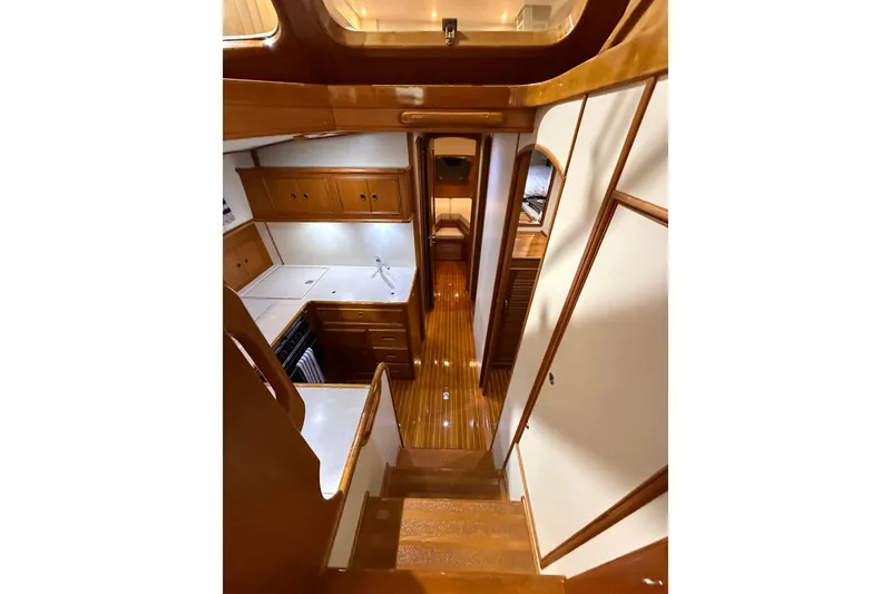 Slide: The Image of Interior of 2000 Grand Banks 43 Eastbay FB yacht, featuring wooden cabinetry and sleek design. - 90