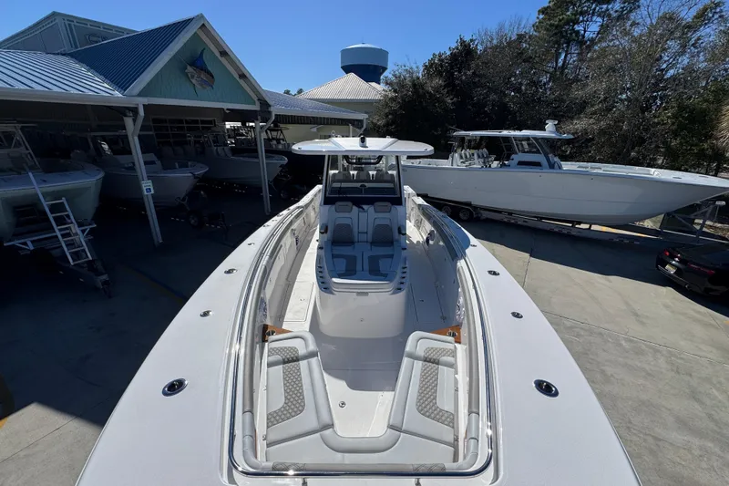 Slide: The Image of 2027 Caymas 401 CC boat displayed at a marina with other vessels. - 19