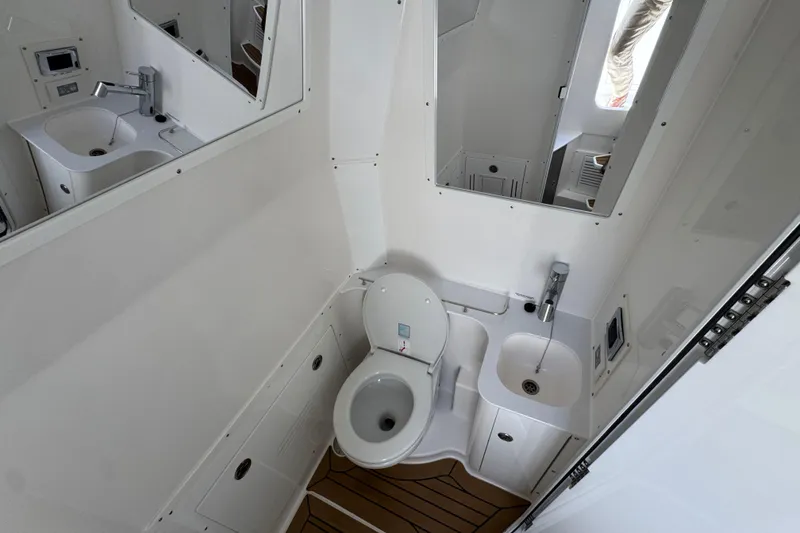 Slide: The Image of Modern bathroom in 2027 Caymas 401 CC boat with sink and toilet. - 26