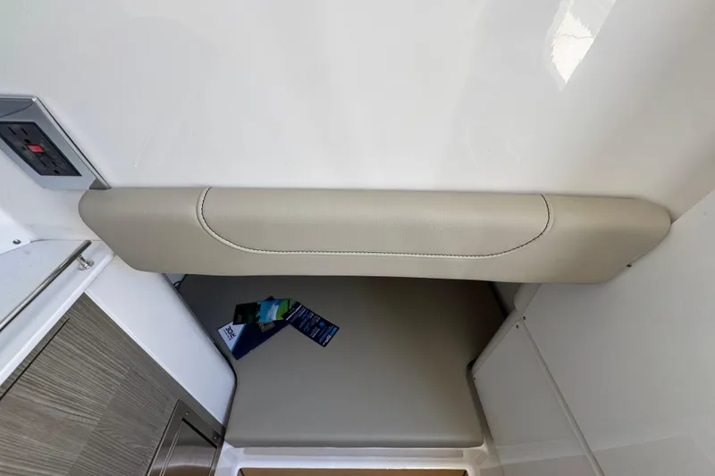 Slide: The Image of Interior view of 2027 Caymas 401 CC boat, featuring beige upholstery and modern design elements. - 31