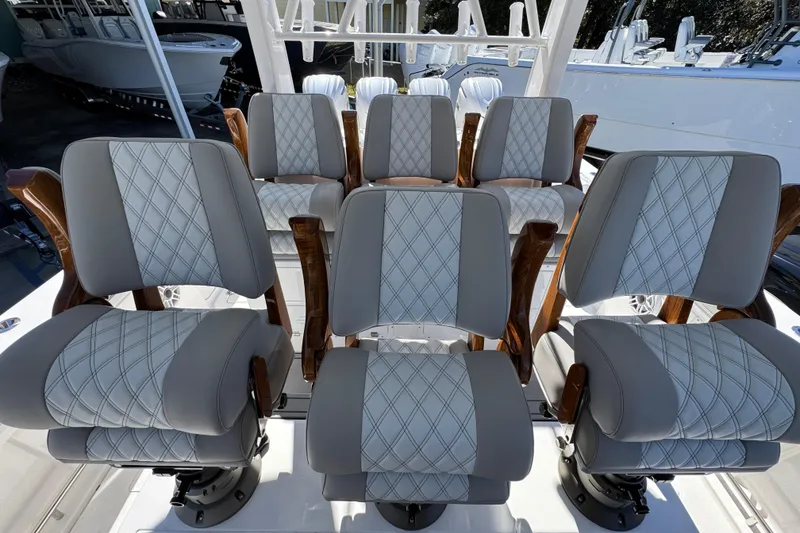 Slide: The Image of Luxurious seating on 2027 Caymas 401 CC boat, featuring elegant diamond-patterned upholstery. - 34