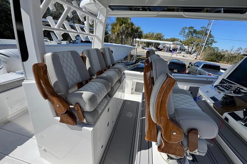 Slide: The Image of Luxurious seating on 2027 Caymas 401 CC boat, featuring elegant wood accents and modern design. - 37