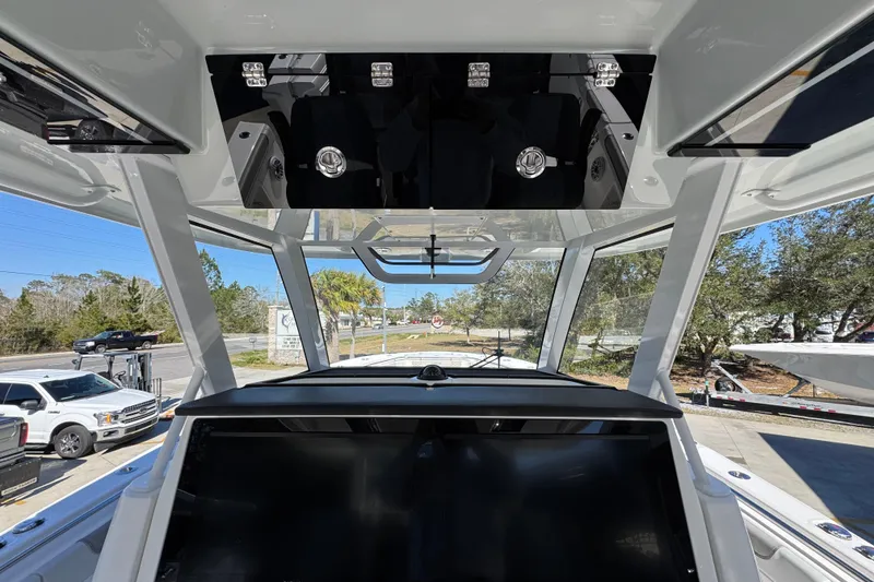Slide: The Image of 2027 Caymas 401 CC boat interior with modern dashboard and panoramic windows. - 41