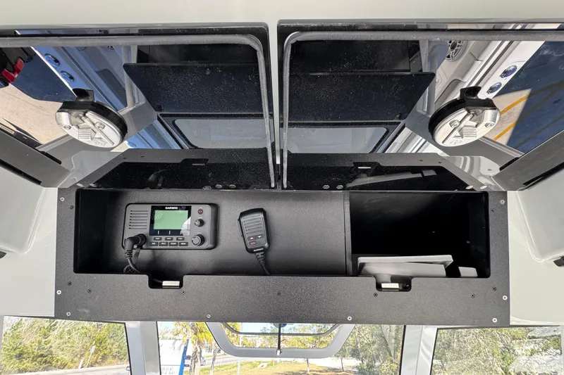 Slide: The Image of Overhead console of 2027 Caymas 401 CC boat with communication equipment. - 42