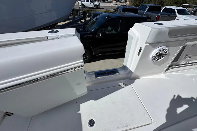 Slide: The Image of 2027 Caymas 401 CC boat interior with speaker and storage compartments. - 43