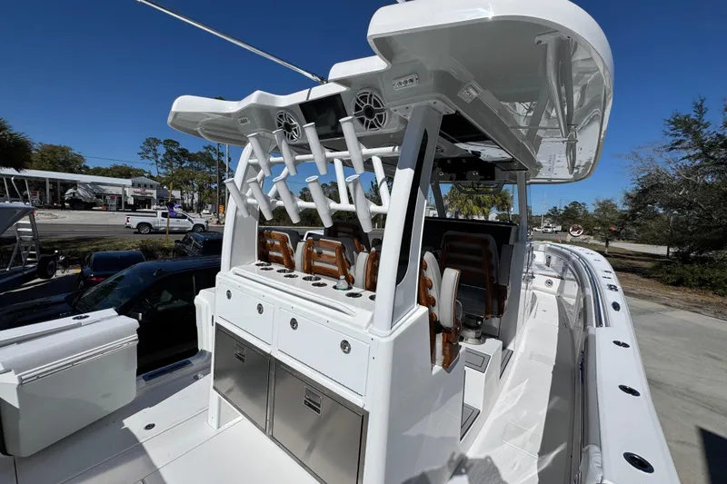 Slide: The Image of 2027 Caymas 401 CC boat with sleek design and modern amenities, docked outdoors. - 46