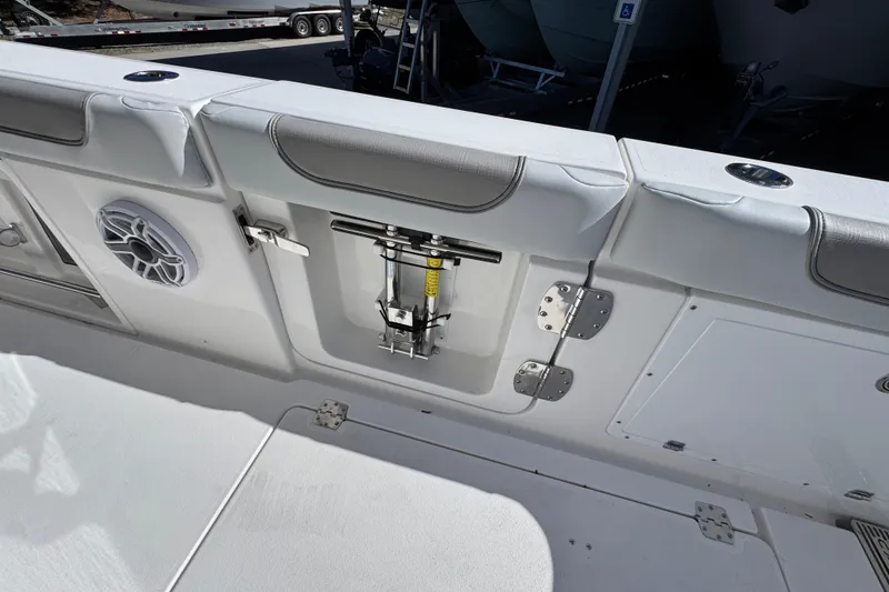 Slide: The Image of 2027 Caymas 401 CC boat interior with speaker and storage compartment. - 47