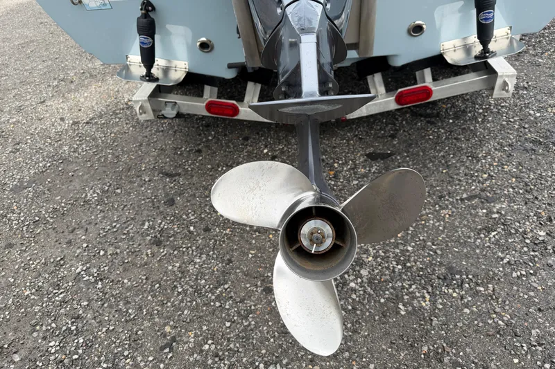 Slide: The Image of 2025 Skeeter SX241 boat propeller on trailer, close-up view. - 11