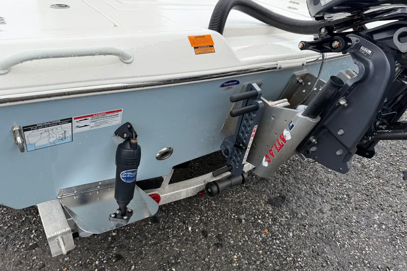 Slide: The Image of 2025 Skeeter SX241 boat transom with motor mount and hydraulic components. - 2