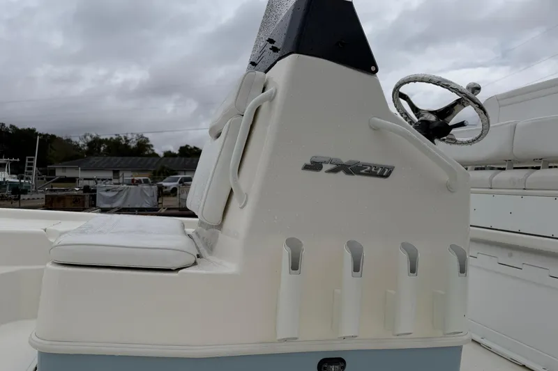 Slide: The Image of 2025 Skeeter SX241 boat console with seating and steering wheel. - 29