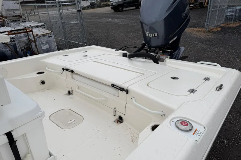 Slide: The Image of 2025 Skeeter SX241 boat with Yamaha 300 engine, white deck, and storage compartments. - 31