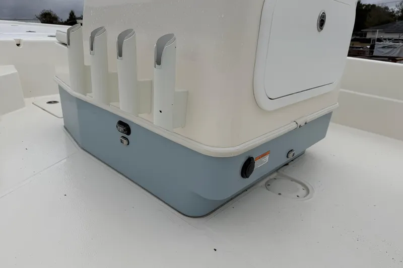 Slide: The Image of 2025 Skeeter SX241 boat console with rod holders and storage compartment. - 34
