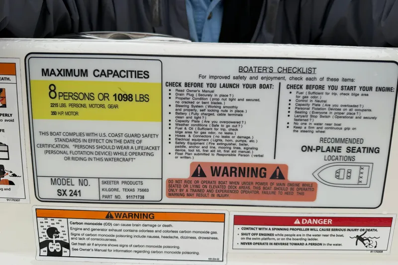 Slide: The Image of Skeeter SX241 2025 boat capacity and safety instructions. - 35