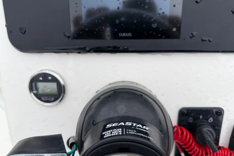 Slide: The Image of Control panel of 2025 Skeeter SX241 boat with SeaStar steering system. - 40