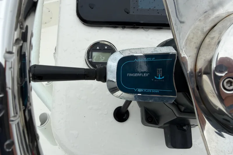 Slide: The Image of Close-up of 2025 Skeeter SX241 boat controls with FingerFlex jack plate lever. - 41