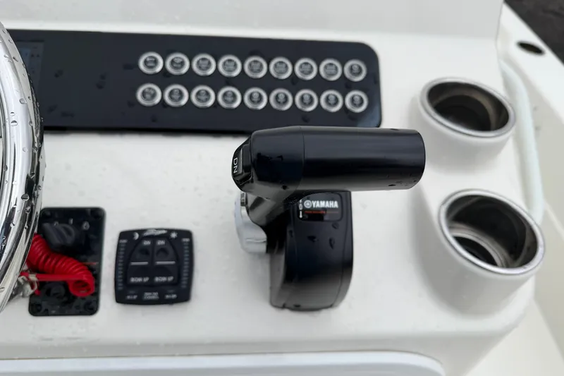 Slide: The Image of Control panel of 2025 Skeeter SX241 boat with Yamaha throttle and switches. - 42