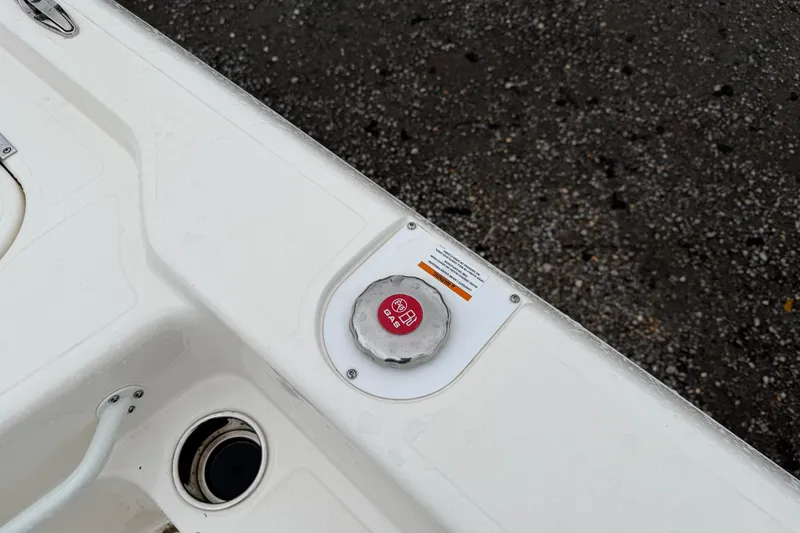 Slide: The Image of Skeeter SX241 2025 boat fuel cap on white deck. - 44