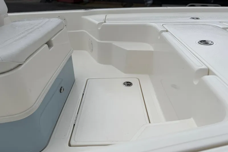 Slide: The Image of 2025 Skeeter SX241 boat interior with storage compartments and seating. - 52
