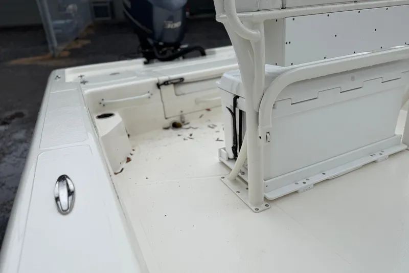 Slide: The Image of 2025 Skeeter SX241 boat interior with seating and storage, showcasing clean white design. - 56