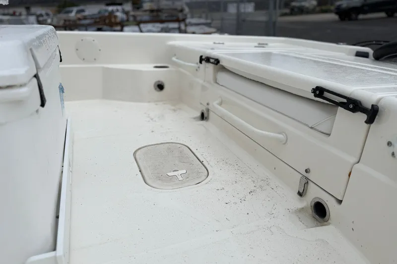 Slide: The Image of 2025 Skeeter SX241 boat interior with storage compartments and seating area. - 59