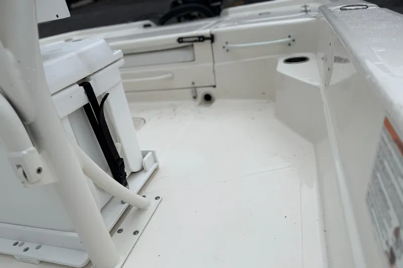 Slide: The Image of 2025 Skeeter SX241 boat interior, featuring white seating and storage compartments. - 60