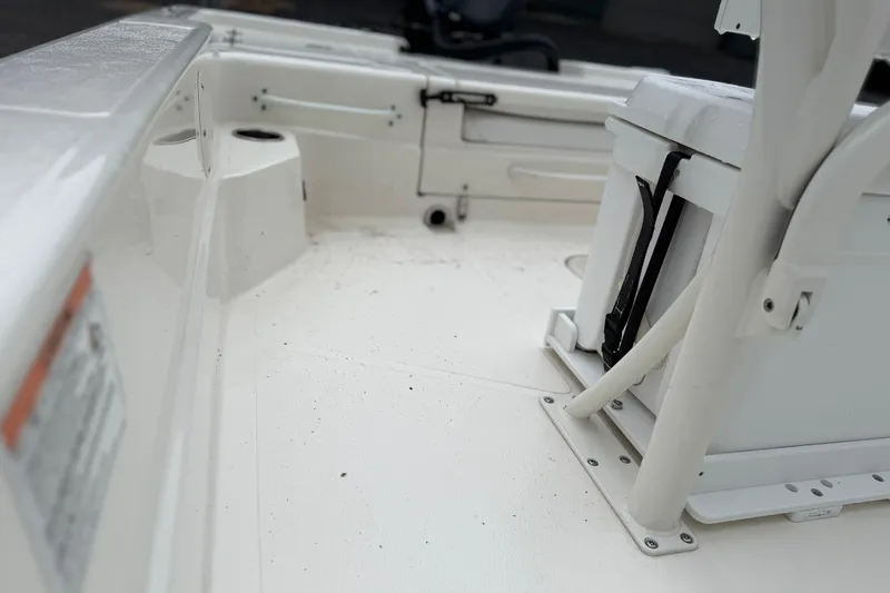 Slide: The Image of 2025 Skeeter SX241 boat interior, featuring white seating and clean deck design. - 63