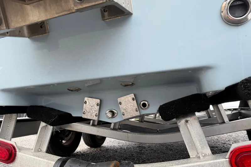 Slide: The Image of Skeeter SX241 2025 boat hull on trailer, showing underside and fittings. - 7