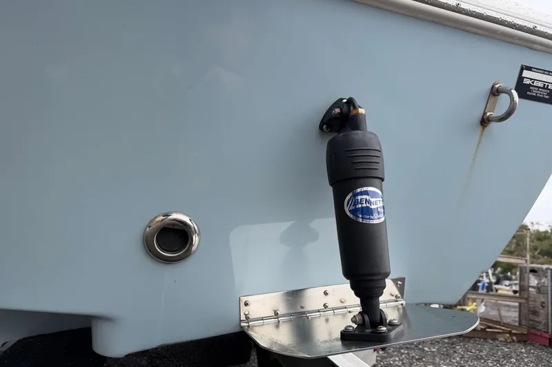 Slide: The Image of 2025 Skeeter SX241 boat with Bennett trim tab and exhaust port. - 8