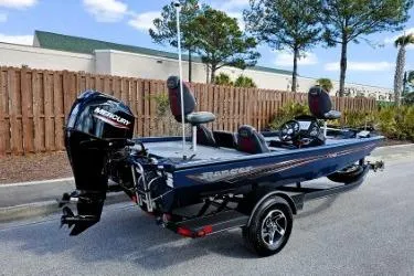 Slide: The Image of 2022 Ranger RT178 boat with Mercury engine, parked outdoors on a trailer. - 10