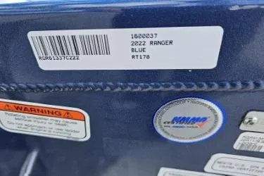 Slide: The Image of Label on 2022 Ranger RT178 boat, blue color, with warning and certification stickers. - 12