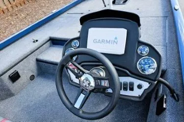 Slide: The Image of 2022 Ranger RT178 boat dashboard with Garmin display and steering wheel. - 2