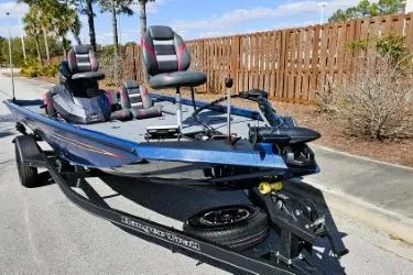 Slide: The Image of 2022 Ranger RT178 fishing boat on trailer, parked outdoors. - 3