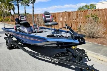 Slide: The Image of 2022 Ranger RT178 fishing boat on trailer, parked outdoors, sunny day. - 8