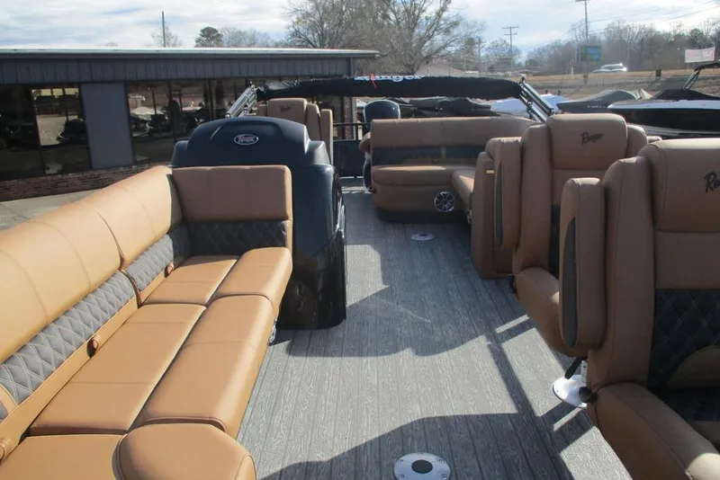 Slide: The Image of 2026 Ranger 220FC boat interior with tan seating and spacious layout. - 7