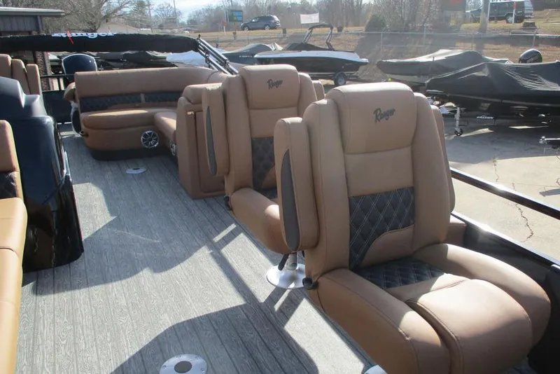 Slide: The Image of Luxurious interior of 2026 Ranger 220FC boat with plush seating and modern design. - 9